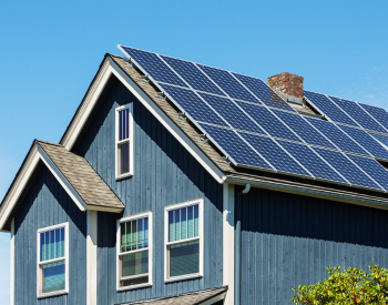 Rooftop solar panels on a River Oaks home under the sun
